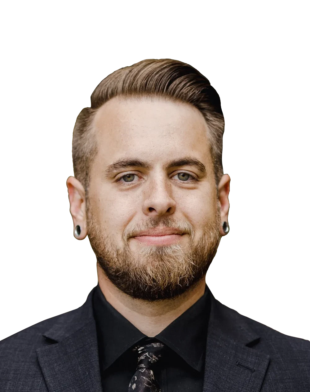 Keifer Erikson smiling, in a dark gray suit, against a dark green background.